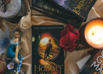 Books and a Lit Candle