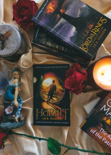 Books and a Lit Candle