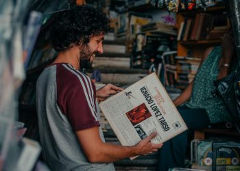 Smiling Man Holding Book