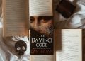 Opened Books on White Bedding