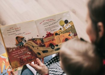Woman Reading Book to Toddler