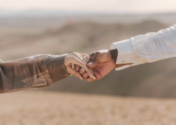 Couple Holding Hands on Desert