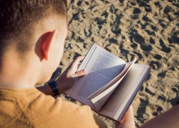 Man Reading Book at Sandy Plains