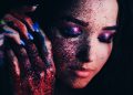Sensual woman with bright glitter makeup