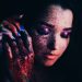 Sensual woman with bright glitter makeup