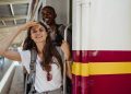 Women Standing on the Train Door