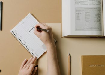Person Writing on a Calendar