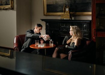 Photo of Man Pouring his Date's Drink