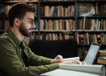 Man in Green Dress Shirt Wearing Eyeglasses