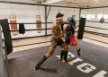 A Man and a Woman Doing Boxing Training