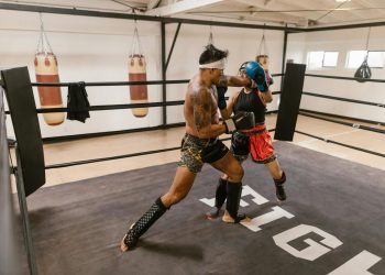 A Man and a Woman Doing Boxing Training