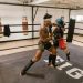 A Man and a Woman Doing Boxing Training